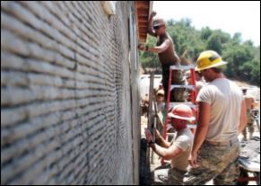 Military personnel help build the NTC